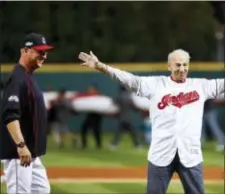  ?? THE ASSOCIATED PRESS FILE ?? John “Tito” Francona, right, former Cleveland Indians outfielder and father of current manager Terry Francona, left, reacts after throwing a ceremonial first pitch before Game 1 of the American League Division Series against the Boston Red Sox.