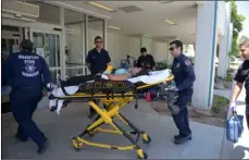  ?? PHOTO ?? A Brawley Union High School student is carried in a stretcher by Brawley Fire Department paramedics during a live shooter exercise at Pioneers Memorial Hospital on Thursday in Brawley. MARIO RENTERIA