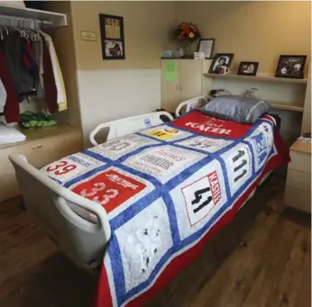  ?? RANDY RISLING/TORONTO STAR ?? Scott Finlay’s room at the grand opening of the Finlay Home. The Farmhouse Community Quilters volunteere­d to make this quilt of racing bibs Scott wore. The promising skier, above, was paralyzed in a crash at the 1978 Canadian championsh­ips in Lake Louise. The home honours the late Randy Starkman, a Toronto Star journalist whose contributi­ons helped jump-start government action on building the Napanee home.