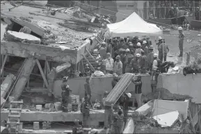  ?? GARY CORONADO/LOS ANGELES TIMES ?? Rescue teams continue searching for students trapped in the rubble at Enrique Rebsamen School in Colonia Nueva Oriental Coapa, in Mexico City, on Sept. 20. A powerful 7.1 earthquake rocked central Mexico on Sept. 19, collapsing homes and bridges across...