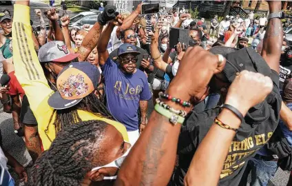  ?? Chang W. Lee / New York Times ?? Protesters rally for Jacob Blake near the church where Joe Biden, the Democratic nominee for president, spoke in Kenosha, Wis., on Sept. 3. Many voters now say law and order is just as important as solving the coronaviru­s pandemic.