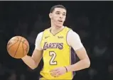  ?? Jae C. Hong Associated Press ?? LONZO BALL has missed 15 games with a sprained ligament in his left knee.