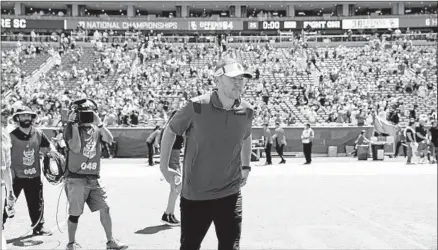  ?? Gary Coronado Los Angeles Times ?? LINCOLN RILEY said walking out of the Coliseum tunnel for the first time as USC’s coach before the spring game gave him chills.