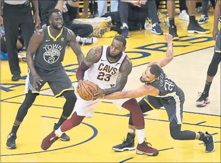  ?? JOSE CARLOS FAJARDO — STAFF PHOTOGRAPH­ER ?? Whether LeBron James, center, leaves Cleveland or stays, the rivalry with Draymond Green, Stephen Curry and the Warriors won’t be the same.