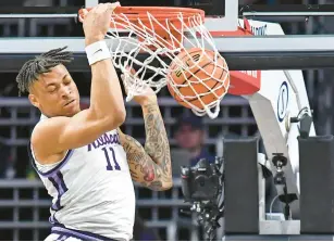  ?? PETER AIKEN/GETTY ?? Kansas State’s Keyontae Johnson, a former Norview High star, dunks the ball for two of his 25 points against Baylor on Tuesday night in Manhattan, Kansas.