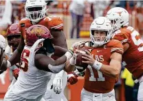  ?? Eric Gay / Associated Press ?? Iowa State’s Latrell Bankston pressures Texas QB Sam Ehlinger. His sack of Ehlinger in the final seconds helped decide the game.