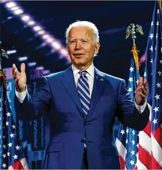  ?? CAROLYN KASTER / ASSOCIATED PRESS ?? Ex-Vice President Joe Biden, seen on stage Wednesday after Sen. Kamala Harris spoke in Wilmington, Delaware, was expected to have a positive focus in his Thursday night speech.