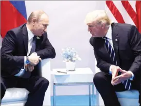  ?? SAUL LOEB/AFP ?? US President Donald Trump and Russia’s President Vladimir Putin hold a meeting on the sidelines of the G20 Summit in Hamburg, Germany, on July 7.