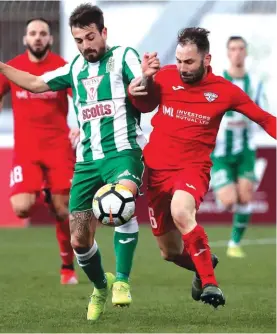  ??  ?? Jose Ulises Arias (L) of Floriana and Balzan's Paul Fenech (R) vie for the ball as the Greens got back to winning terms. Photo: Domenic Aquilina