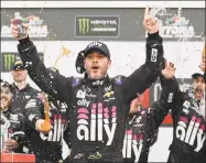  ?? John Raoux / Associated Press ?? Jimmie Johnson celebrates in Victory Lane after winning the NASCAR Clash on Feb. 10 at Daytona Internatio­nal Speedway in Daytona Beach, Fla.