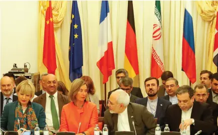  ?? (Leonhard Foeger/Reuters) ?? EUROPEAN UNION High Representa­tive for Foreign Affairs and Security Policy Federica Mogherini (front row, second left) and Iran’s Foreign Minister Mohammad Javad Zarif (front row, second right) meet in Vienna in July.