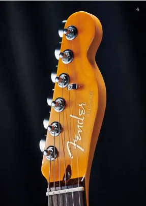  ??  ?? 4. The raised metallic logo changes from chrome to gold here. The maple necks are lightly toned, too. As with the Elites, bone nuts are standard. Note the truss rod adjustment behind the bone nut
5. Rosewood replaces the ebony used on the Elites. The compound fingerboar­d radius very slightly changes and neck profile moves to a Modern ‘D’ 4