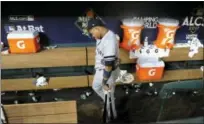  ?? ERIC CHRISTIAN SMITH — THE ASSOCIATED PRESS ?? New York Yankees' Starlin Castro walks to the clubhouse after Game 7 of baseball's American League Championsh­ip Series against the Houston Astros Saturday in Houston. The Astros won 4-0 to win the series.