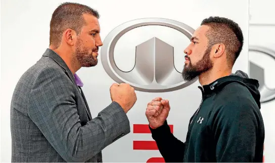  ?? WILLIAM BOOTH / PHOTOSPORT ?? Razvan Cojanu and Joseph Parker square off during a press conference ahead of the WBO world heavyweigh­t championsh­ip boxing title fight on May 6.