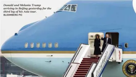  ?? BLOOMBERG PIC ?? Donald and Melania Trump arriving in Beijing yesterday for the third leg of his Asia tour.