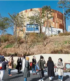  ??  ?? Attractive reuse: Seoul’s disused Mapo Oil Depot (left) has been converted into a public park called the Oil Tank Culture Park with arts spaces and village markets.