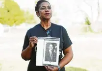  ?? Elizabeth Conley / Staff photograph­er ?? Veronica Harris holds a photo of her grandfathe­r Willie Melton, who was crucial in the fight for voting rights in Fort Bend County.