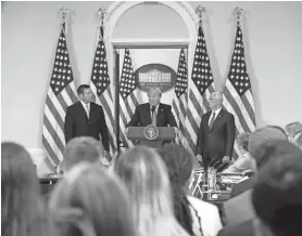  ?? PABLO MARTINEZ ?? President Donald Trump, with Kansas Secretary of State Kris Kobach, left, and Vice President Mike Pence, speaks at a meeting of the Presidenti­al Advisory Commission on Election Integrity in Washington in 2017. MONSIVAIS / AP