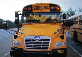  ?? BOB ANDRES / AJC ?? About 86 percent of Atlanta Public Schools’ bus driver positions were filled, according to a tally last week. APS has 407 available driver jobs this school year, including 56 openings. The district is still hiring drivers who will help provide...