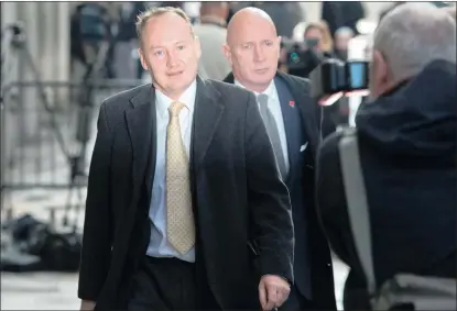  ?? PICTURE: AP ?? Gary Clarence, left, leaves the Old Bailey in London where his wife, Tania, was sentenced yesterday for manslaught­er by diminished responsibi­lity of their children Olivia, 4, and 3-year-old twins Ben and Max, who all suffered from type 2 spinal...