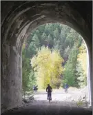  ?? J.P. SQUIRE/Special to The Okanagan Weekend ?? The former Kettle Valley Railway line in the Similkamee­n Valley has two tunnels and several bridges west of Princeton. The wide trail is popular with hikers and cyclists but flashlight­s are recommende­d for the longer tunnel.