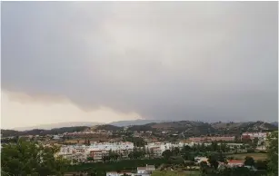  ?? (Facebook/Bruno Alves/via Reuters) ?? SMOKE IS seen above Silves, Portugal, on Saturday.