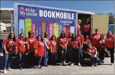  ?? Contribute­d photo ?? The Read to Grow staff celebrates the launch of the bookmobile at the Thomas W. Mahan Elementary School in Norwich.