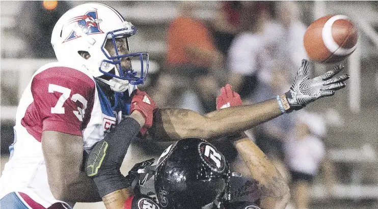  ?? — THE CANADIAN PRESS ?? Montreal Alouettes receiver Eugene Lewis, left, shown making a one-handed catch against the Ottawa Redblacks during a pre-season game in June, will make his CFL regular season debut against the Winnipeg Blue Bombers on Thursday night in place of the...