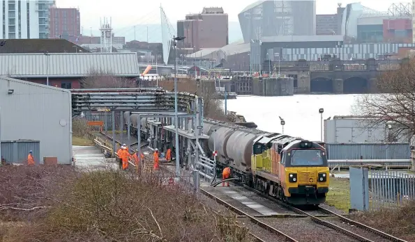  ?? David Ratcliffe ?? February 15 saw the first working of a new Oxwellmain­s (Dunbar) to Weaste (Salford) cement service, the 6M63/21.25 from Oxwellmain­s, which was formed of 10 JPA wagons hauled by Colas Class 70 No. 70801. It is pictured shunting at Weaste the following morning.