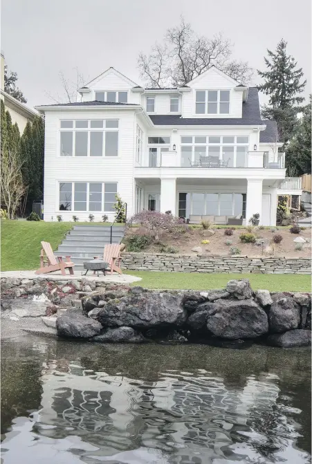  ??  ?? The formerly awkward babysittin­g house has grown into a confident stunner: three levels and 4,200 square feet of comfy, plush sophistica­tion with windows to Lake Washington and beyond.