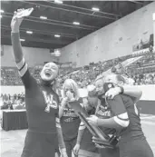  ?? SAM THOMAS/ORLANDO SENTINEL ?? Winter Park cheerleade­rs take a selfie after winning a state title on Saturday.