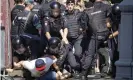  ??  ?? Police officers detain protesters during an unsanction­ed rally in Moscow on Saturday. Photograph: Alexander Zemlia