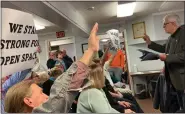  ?? EVAN BRANDT — MEDIANEWS GROUP ?? The crowd reacts Jan. 17as Upper Pottsgrove Commission­ers Chairman Trace Slinkerd tried to silence former commission­er Herb Miller’s protests about plans to use land purchased as open space for a new municipal building.