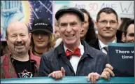  ?? AP/SAIT SERKAN GURBUZ ?? Bill Nye (center), chief executive of the Planetary Society who is known as the “Science Guy,” joins the march Saturday in Washington as honorary co-chairman.