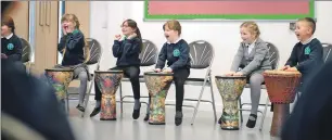  ??  ?? Steve Sharpe, right, from Forres-based Drumfun provided an educationa­l and fun event for the pupils at St Columba’s Primary School in Fort William, left and above.