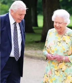  ??  ?? Sharing a joke: The Queen chats with Sir David Attenborou­gh