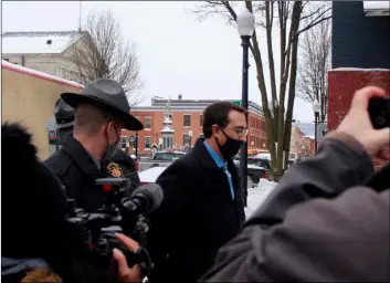  ?? Review via AP
Brianne Ostrander/The Daily ?? Bradford County, Pa., District Attorney Chad Salsman is escorted into Magisteria­l District Court, on Wednesday in Towanda, Pa.