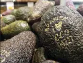  ?? AP PHOTO/JAMES BROOKS ?? Laser branded avocados are displayed at the ICA Kvantum supermarke­t in Malmo, Sweden.