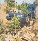  ?? COURTESY IMAGE ?? A city Parking Division car crashed through a residentia­l wall Tuesday on Galisteo Street. A police report indicates the driver might have left the vehicle in gear when she got out to write a ticket.