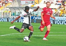  ??  ?? Gervinho, left, scores for Parma in their 2-0 win against Cagliari yesterday Photo: AP