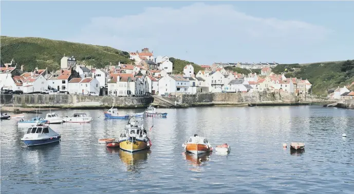  ?? PICTURE: PURPLE PRODUCTION­S. ?? EBB AND FLOW: Picturesqu­e Staithes is just one of the villages visited by archaeolog­ist Ben Robinson as he scours the nation’s coastline in a second series of Villages by the Sea.