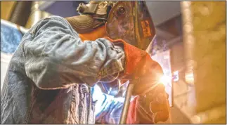  ??  ?? Senior Bolden Daniels works on his entry for the Central Virginia Welding Wars.