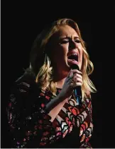  ??  ?? This file photo shows British singer Adele performs onstage during the 59th Annual Grammy music Awards in Los Angeles, California. — AFP