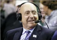  ?? RAY CARLIN — THE ASSOCIATED PRESS ?? ABC/ESPN basketball analyst Dick Vitale sits at midcourt prior to an NCAA college basketball game between Baylor and Villanova, Sunday, Dec. 12, 2021, in Waco, Texas.