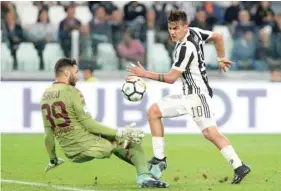  ?? — Reuters ?? Paulo Dybala scores their fourth goal past Torino’s Salvatore Sirigu.