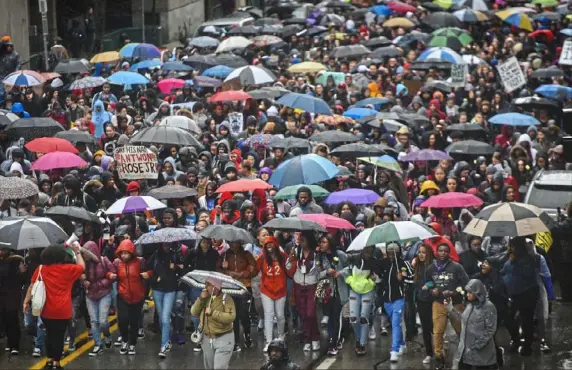  ?? Steve Mellon/Post-Gazette ?? About 1,000 people, mostly high school and college students, march along Liberty Avenue in Downtown on Monday to protest the acquittal of Michael Rosfeld in the killing of Antwon Rose II.