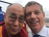  ??  ?? Dream life: The Dalai Lama (left) with Eric Swaffer who died when the helicopter that he was piloting crashed on Saturday