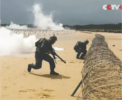  ?? SCREENGRAB / CCTV+ ?? Chinese soldiers work on drills that continue the recent trend of intimidati­on tactics directed at Taiwan.