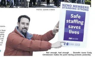  ??  ?? Not enough, had enough . . . Dunedin nurse Craig Christense­n makes his point during protests yesterday.