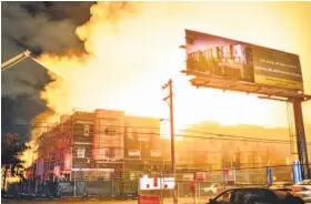  ?? John Orvis 2018 ?? Fire consumes an apartment building under constructi­on at Filbert Street and Grand Avenue in West Oakland, one of a series of East Bay arsons last year.